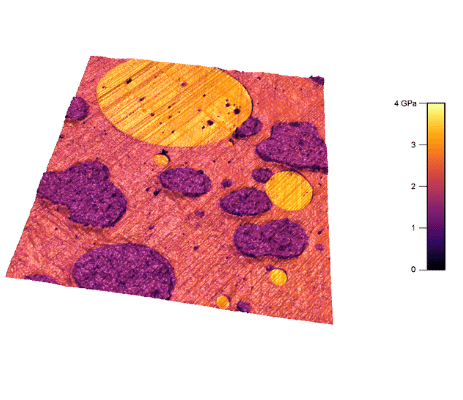 Polymer blend sample composed of polyethylene (darkest), polypropylene (matrix) and polystyrene (brightest). The 3D overlay of elastic modulus on topography. Image size: 25 um. AM-FM Viscoelastic Mapping Mode on Jupiter XR Atomic Force Microscope (AFM)